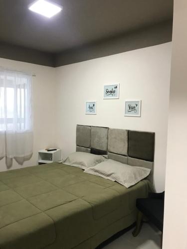 Postel nebo postele na pokoji v ubytování Apartamento novo bertioga