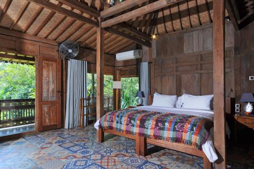 Säng eller sängar i ett rum på Bali Lush