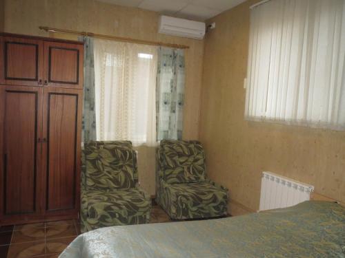 Guest House Avenue tesisinde bir odada yatak veya yataklar