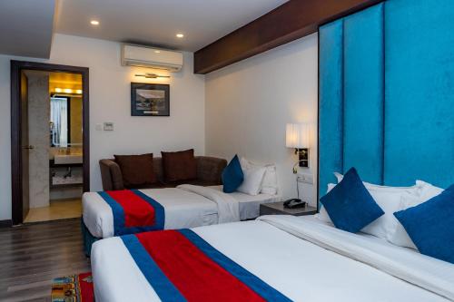 מיטה או מיטות בחדר ב-M Hotel Thamel-Kathmandu