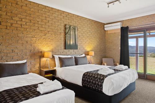 Ένα ή περισσότερα κρεβάτια σε δωμάτιο στο Lookout Mountain Retreat