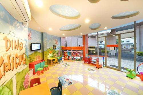 a large room with a playroom with a toy at HARRIS Hotel Sentul City Bogor in Bogor