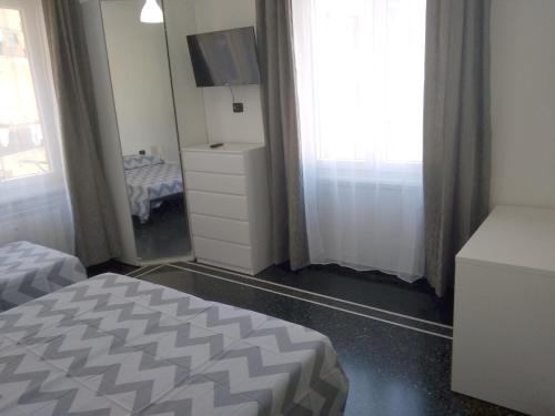Ένα ή περισσότερα κρεβάτια σε δωμάτιο στο B&B Gaslini & Mare (anche con uso cucina)