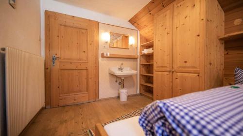 a bathroom with a sink and a toilet in a room at Ferienhaus Sternhof in Mieders