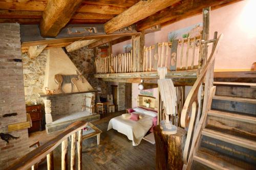 a living room with a staircase and a room with a bed at Luxury villa Colle dell'Asinello ,proprietari ,Villa In esclusiva near ORVIETO in Guardea