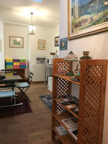 a living room with a table and a dining room at Alain et Nicole in Cognac