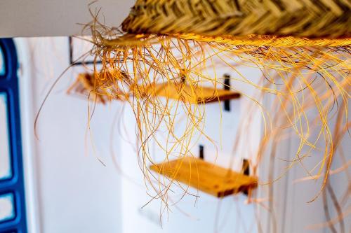 a group of small planes are hanging from a wicker at Hôtel Emeraude Essaouira in Essaouira