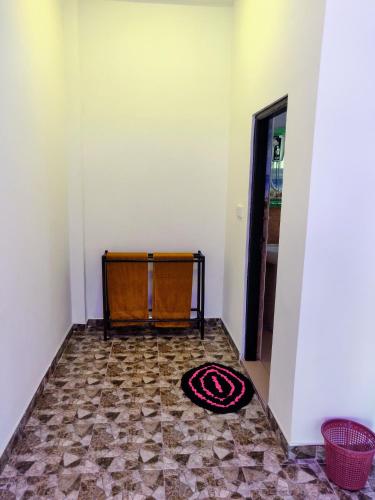 a room with a rug on the floor at Pearl Cave Cabanas & Resturant in Tangalle