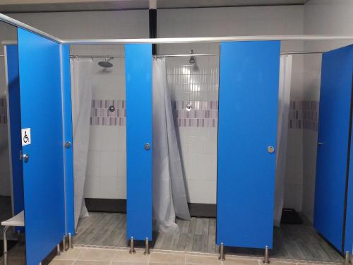 a room with blue doors in a bathroom at Albergue Monterrey in Santiago de Compostela