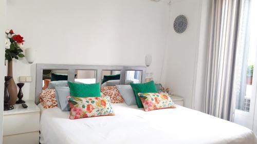 two beds with pillows and pillows in a room at Hostal Casa Chueca in Madrid