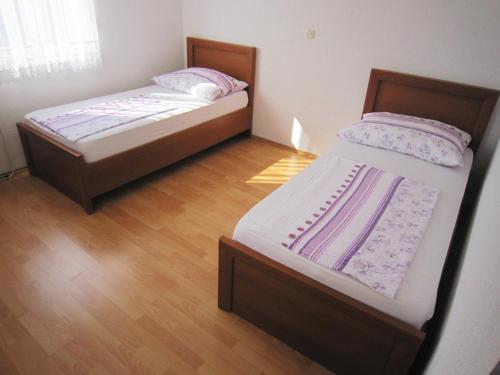 Posteľ alebo postele v izbe v ubytovaní Apartments Milic