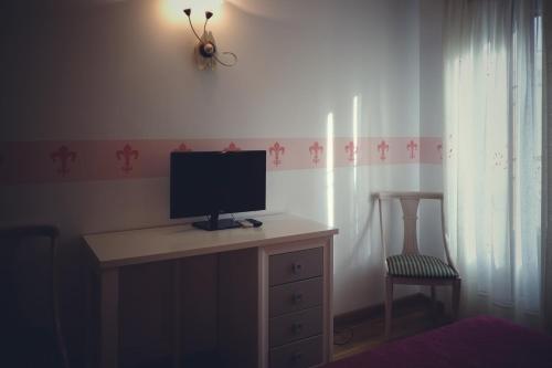 a computer monitor on a desk in a room at La Juderia de Las Arribes in Vilvestre