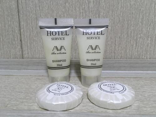 two bottles of moisturizing moisturizers sitting next to each other at Leila Apartment in Tbilisi City