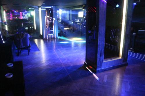 a room with a dance floor with blue lights at Hor Moheb Hotel in Cairo