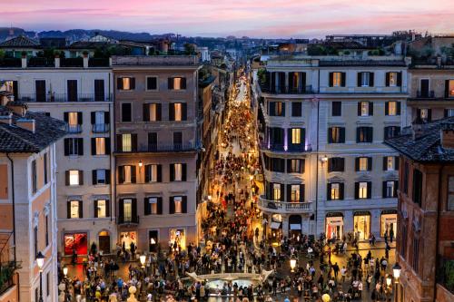 a christmas tree in the middle of a city at Rocco Forte Hotel De La Ville in Rome