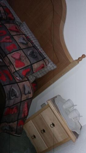 a bedroom with a bed and a glass wall at Locanda 130 in Fonni