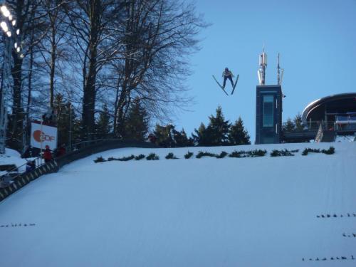 a person is doing a trick in the snow at Hotel Goldflair am Rathaus in Korbach