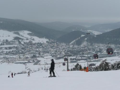 a person on skis in the snow on a ski slope at Hotel Goldflair am Rathaus in Korbach