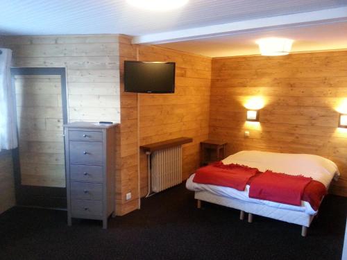 Кровать или кровати в номере Hôtel La Vanoise
