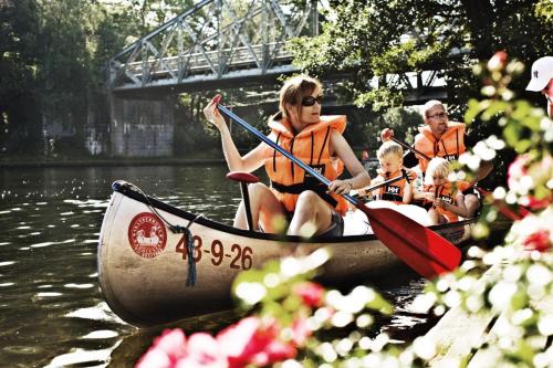 a group of people in a boat on the water at Danhostel Silkeborg in Silkeborg