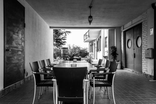 a dining room with a table and chairs at La Vecchia Cantina in Stradella