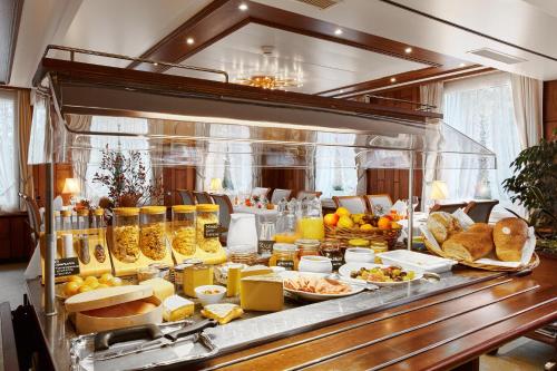 a buffet with many different types of food on display at Hotel & Spezialitätenrestaurant zur Linde in Teufen