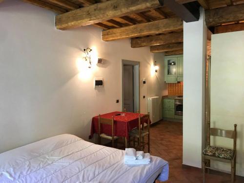 a living room with a table and a red table cloth at Hotel Panoramico in Corfino