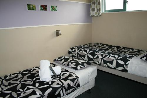 Ένα ή περισσότερα κρεβάτια σε δωμάτιο στο Astray Motel
