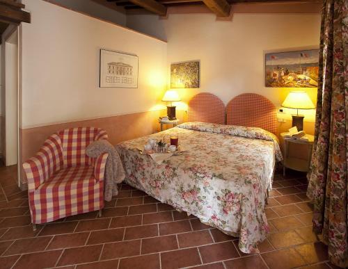 เตียงในห้องที่ Fattoria Santa Lucia Borgo alla Cantina