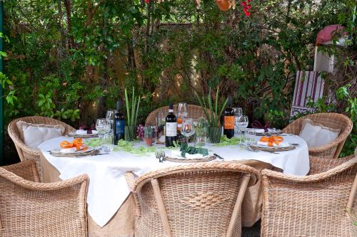 a table with a white table cloth and wine bottles at Fattoria Santa Lucia Borgo alla Cantina in San Gervasio