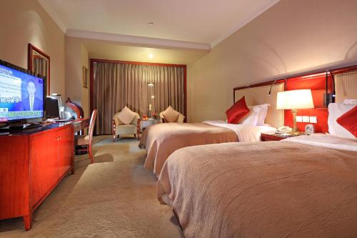 Cama o camas de una habitación en Xinhai Jin Jiang Hotel