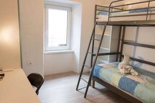 Lliteres en una habitació de Koper2stay