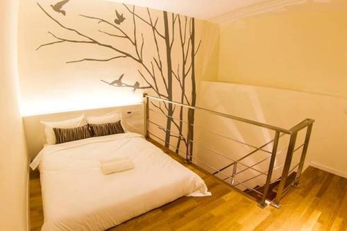 Postel nebo postele na pokoji v ubytování Mood Hotel