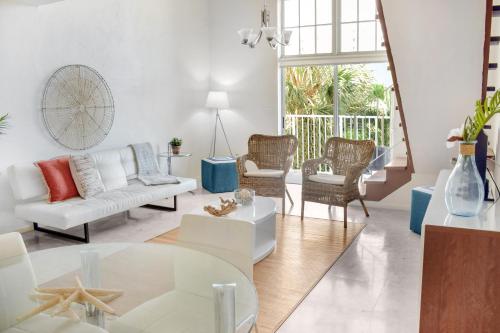 a living room with a couch and a table at Coral Reef at Key Biscayne in Miami