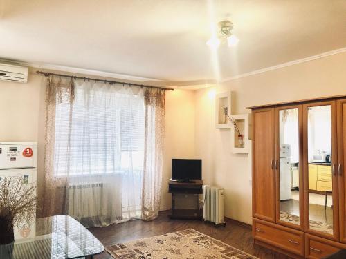 A television and/or entertainment center at 1 bedroom studio in the Luhansk city centre