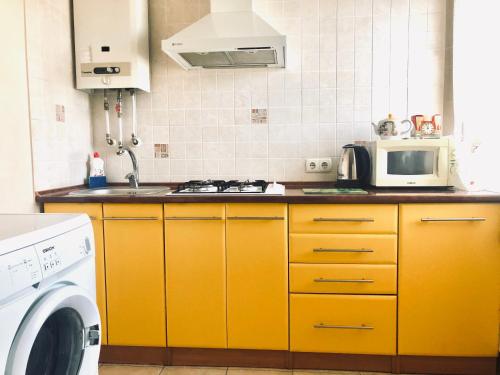 A kitchen or kitchenette at 1 bedroom studio in the Luhansk city centre