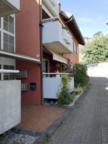 a side view of a building with a driveway at Casa Lu in Levico Terme