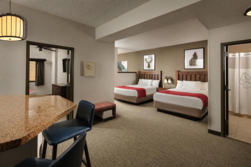 a hotel room with two beds and a bar at Great Wolf Lodge Grapevine in Grapevine