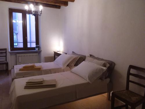 Ένα ή περισσότερα κρεβάτια σε δωμάτιο στο Casa Mellis Verona