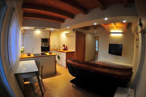 a kitchen with a boat in the middle of a room at APARTAMENTOs URDAIBAI 1 in Bermeo