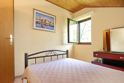 En eller flere senge i et værelse på Kuća za odmor Matoš
