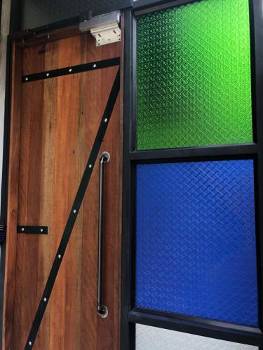 a door with a window in a room at SP Home BangSaen in Bangsaen