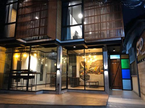 a store front with windows with chairs in it at SP Home BangSaen in Bangsaen