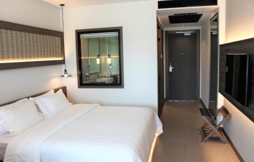 Postel nebo postele na pokoji v ubytování Anana Ecological Resort Krabi - SHA Extra Plus
