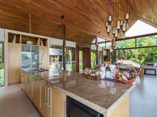 a large kitchen with a large island in a house at Panacea Retreat in Bophut 