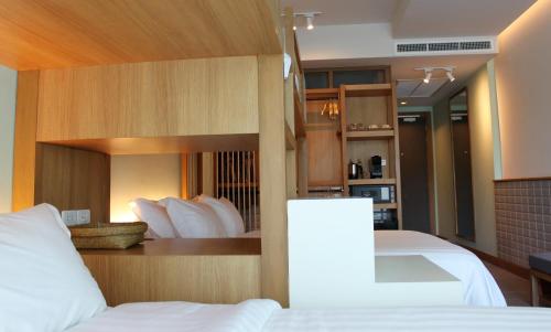 Postel nebo postele na pokoji v ubytování Anana Ecological Resort Krabi - SHA Extra Plus