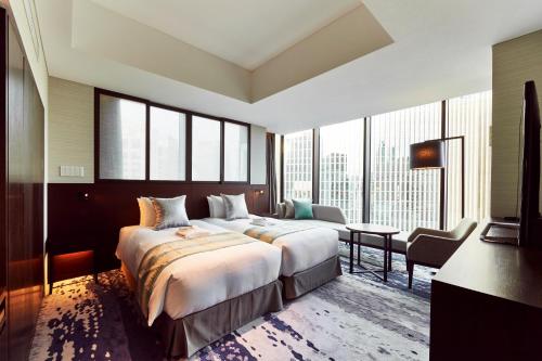 Ein Bett oder Betten in einem Zimmer der Unterkunft The Gate Hotel Tokyo by Hulic