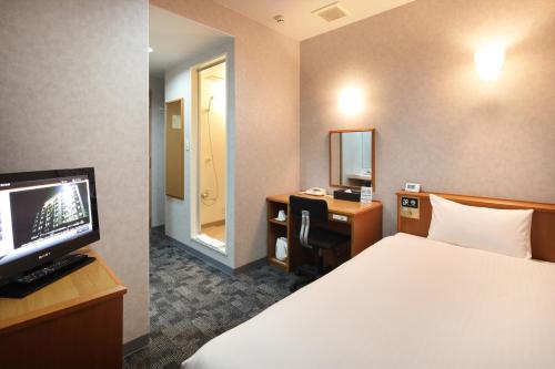 Postel nebo postele na pokoji v ubytování Green Rich Hotel Aso Kumamoto Airport (Artificial hot spring Futamata Yunohana)