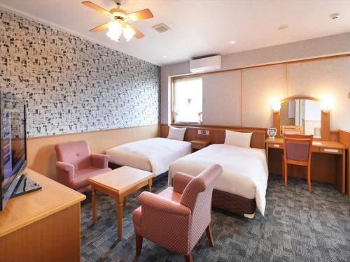 Postel nebo postele na pokoji v ubytování Green Rich Hotel Aso Kumamoto Airport (Artificial hot spring Futamata Yunohana)