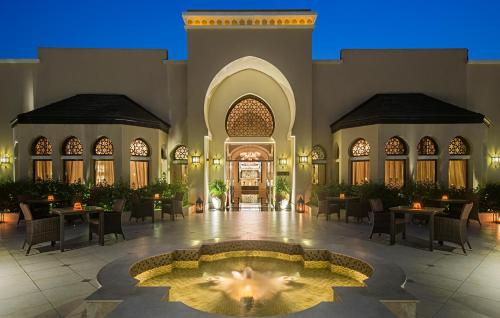 a rendering of the lobby of a resort with a fountain at Miramar Al Aqah Beach Resort in Al Aqah